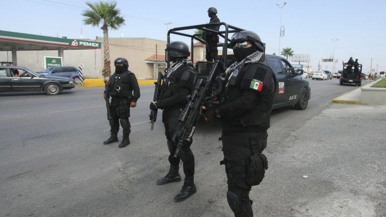 Rapid response Coahuila state police stand at a checkpoint in the city of Piedras Negras, Mexico,