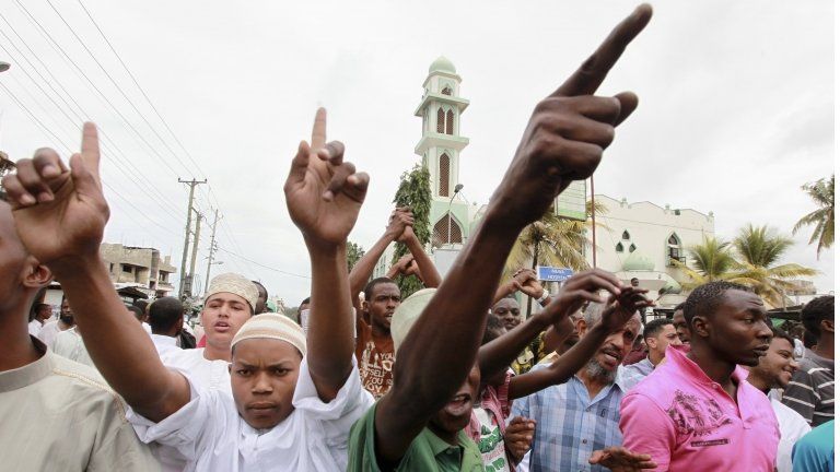 Muslims chant slogans during a protest against the killing of Sheikh Aboud Rogo Mohammed after Friday prayers at the Masjid Musa mosque in the Kenyan coastal city of Mombasa 31 August 2012