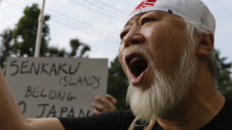 A man shouts slogans at an anti-Chinese rally in Tokyo, 22 September
