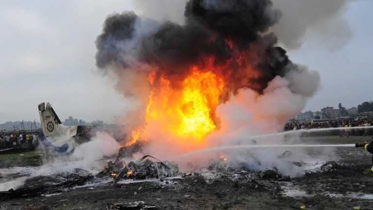 Burning wreckage at crash site in Nepal. 28 Sept 2012