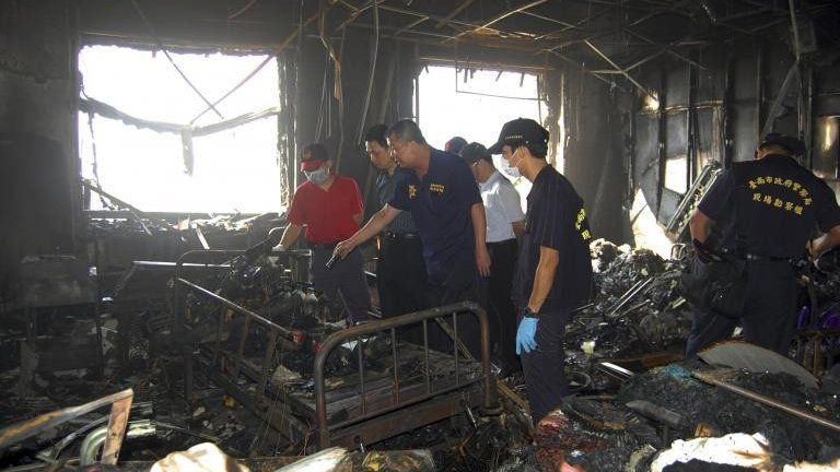 Investigation of an early morning fire that swept through the Hsinying Hospital's nursing ward, early Tuesday, 23 October, 2012, in the southern city of Tainan, Taiwan