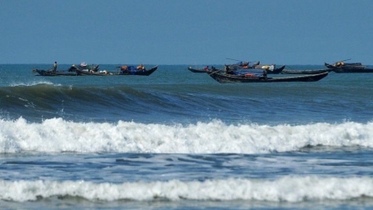 Boats on the Bay of Bengal carry Rohingya away from the violence