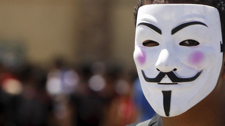 Man wearing Anonymous mask