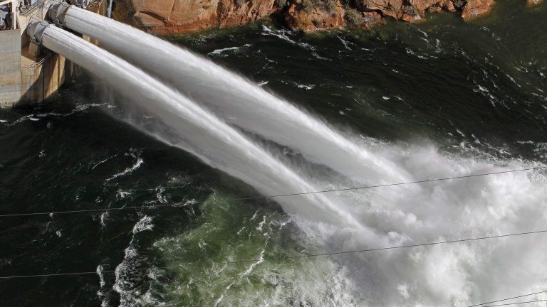 Water pours from river outlet tubes during an experimental high flow release from the Glen Canyon Dam in Page, Arizona