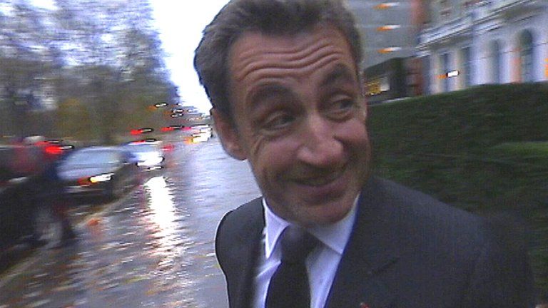 A TV grab shows Nicolas Sarkozy leaving a London hotel on 21 November