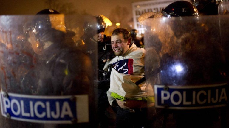 Police detain a protester in Ljubljana. Photo: 30 November 2012