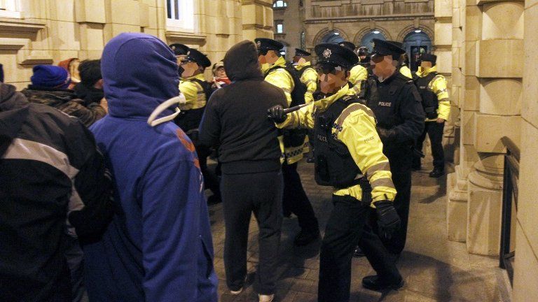 Loyalist protesters forced their way through the back gate of the City Hall