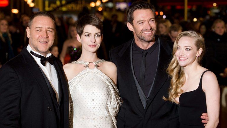 Russell Crowe (L) Anne Hathaway (2-L) Hugh Jackman (2-R) and Amanda Seyfried (R) pose for photographers on the red carpet ahead of the world premiere of Les Miserables
