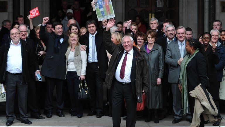 Members of the Hillsborough Support Group and supporters on the steps of the High Court after the High Court quashed the original accidental death verdicts