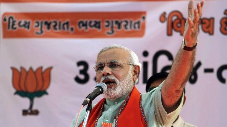 Gujarat Chief Minister Narendra Modi speaks during an election campaign rally for state assembly elections at Prantij in Ahmadabad, India, Saturday, Dec. 15, 2012.