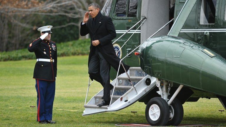 US President Barack Obama steps off Marine One on the South Lawn upon return to the White House in Washington, DC on 27 December 2012