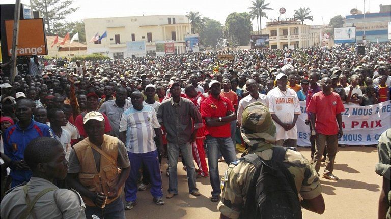 Residents of Bangui listen to an appeal for help by CAR President Francois Bozize. 28 Dec 2012