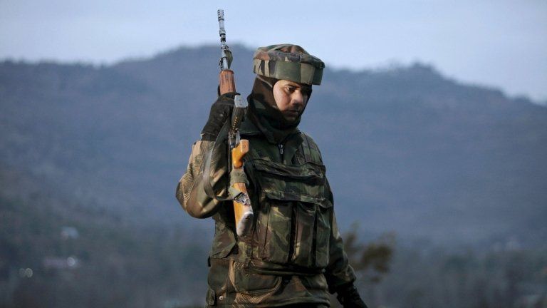 An Indian army soldier patrols near the line of control, the line that divides Kashmir between India and Pakistan, after a reported cease-fire violation, in Mendhar, Poonch district, about 210 kilometers (131 miles) from Jammu, India, Wednesday, Jan. 9, 2013.