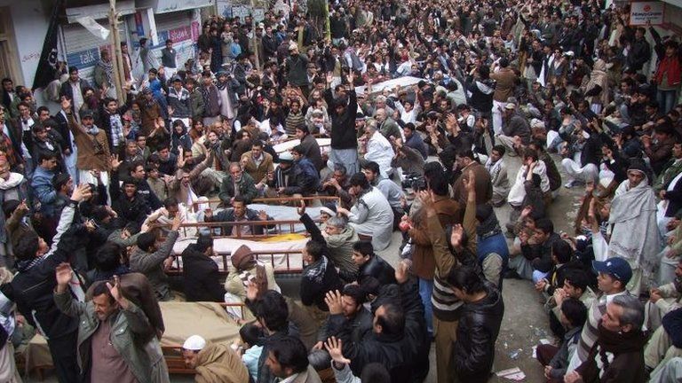 Protesters with victims in Quetta, 11 January