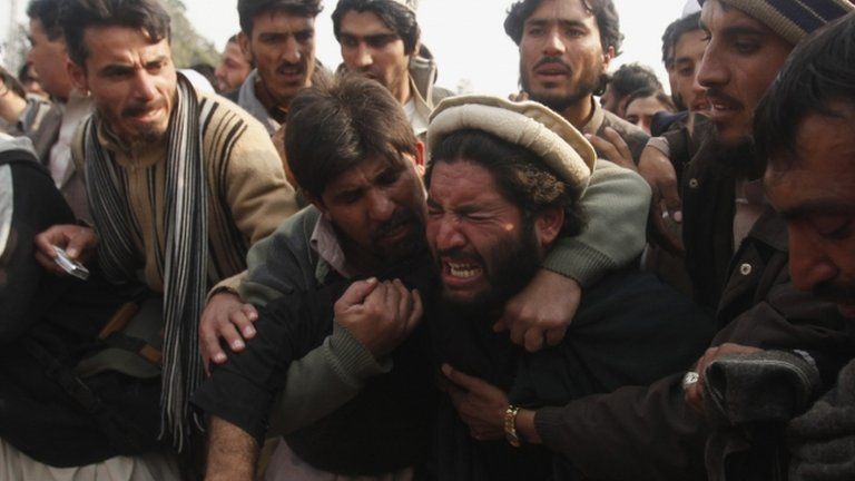 Protesters outside government offices in Peshawar on 16 January 2013