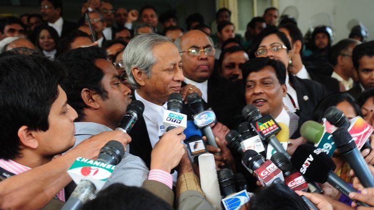Bangladeshi Attorney General Mahbubey Alam talk to journalists following the verdict at the International Crimes Tribunal court premises in Dhaka on January 21, 2013.