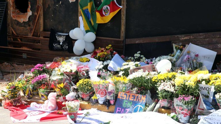 Flowers left in front of the Kiss nightclub in Santa Maria, southern Brazil