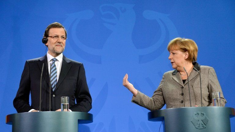 Angela Merkel (R) and Mariano Rajoy address a press conference at the Chancellery in Berlin on 4 February 2013