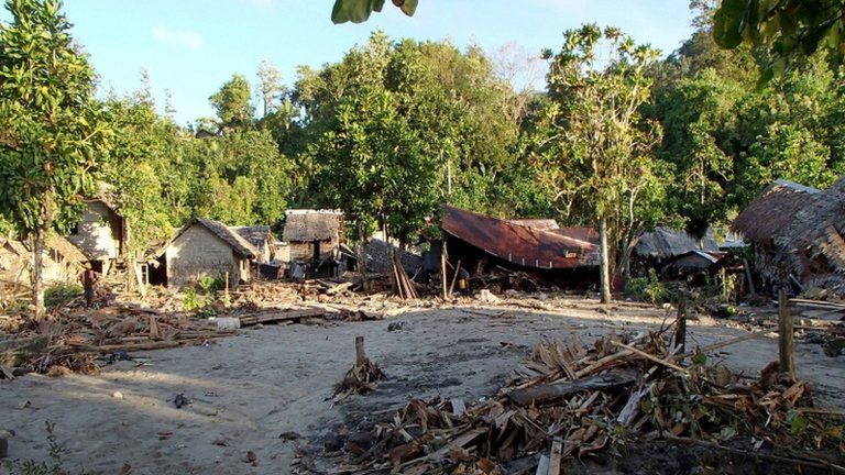 Damaged houses in the village of Venga in the Santa Cruz Islands region of the Solomon Islands on 6 February 2013