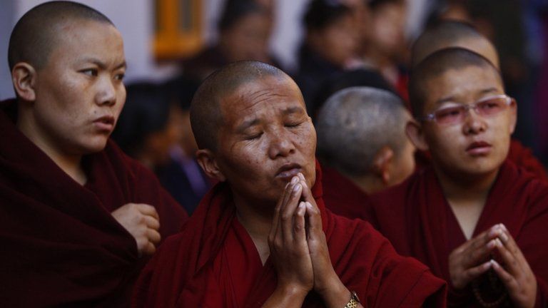 Exiled Tibetan monks praying at a Tibetan Monastery near Boudhanath Stupa, 13 February 2013