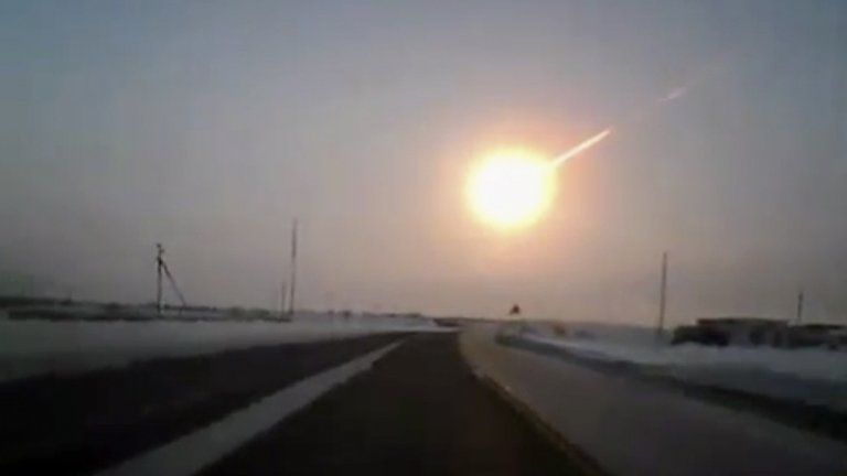 A still from dashboard video recorded in neighbouring Kazakhstan shows the meteor which hit Russia, 15 February