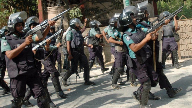Police personnel march towards the activists of Jamaat-e-Islami, Bangladesh"s biggest Islamist party, during a clash in Rajshahi