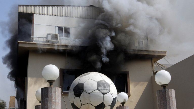 Smoke pours from the Egyptian football federation building on fire in Cairo, 9 March
