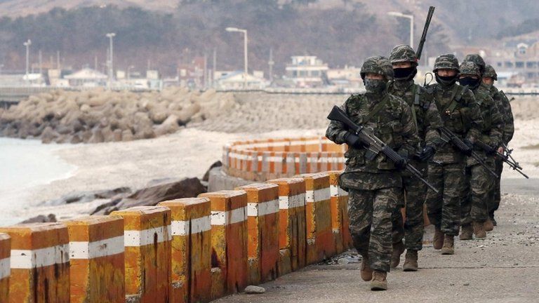 South Korean marines patrol on Yeonpyeong Island near the western maritime border between the two Koreas, 12 March 2013