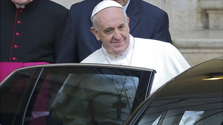 Pope Francis leaves after praying at Santa Maria Maggiore Basilica in Rome. 14 March 2013