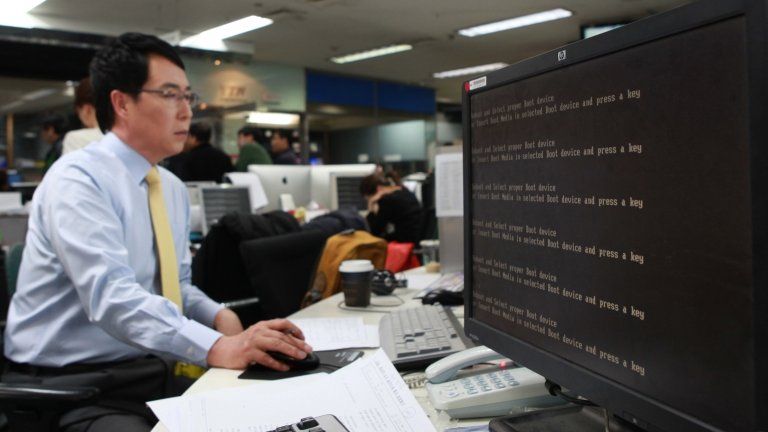 South Korea's YTN broadcaster staffs shut down computers in their offices in Seoul on March 20, 2013.