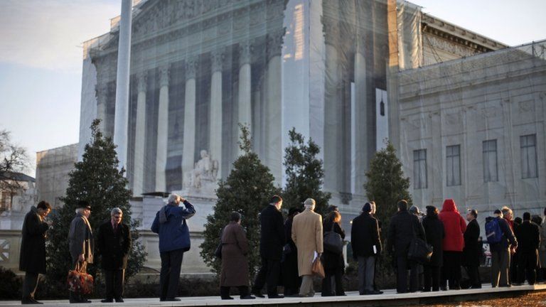 People line up for entrance into the Supreme Court in Washington, 26 March 2013