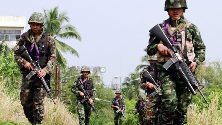 Thai security forces patrol the railway in the troubled southern province of Yala on 27 March 2013