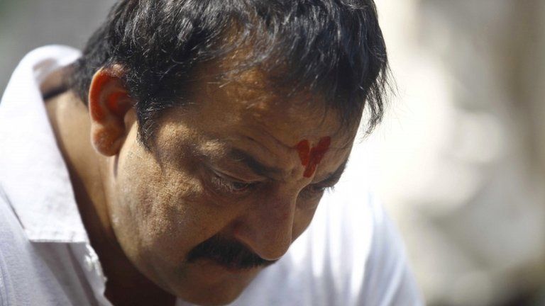 Indian Bollywood actor Sanjay Dutt, looks down during a press conference at his residence in Mumbai, India, Thursday, March 28, 2013