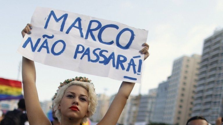 A protester demands the resignation of Marco Feliciano