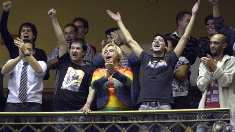 Gay rights activists celebrate in the Uruguayan Congress