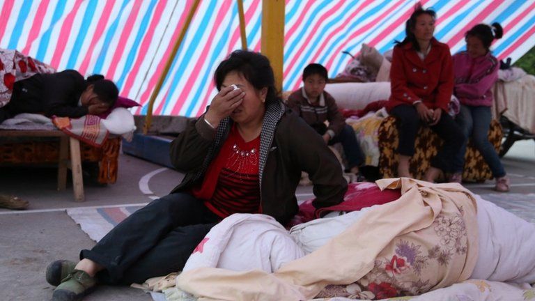 Earthquake survivors rest in a tent in Gonghe, near Ya'an, China 21 April