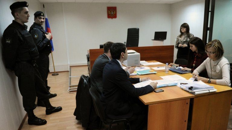 Court officials and lawyers attend the NGO hearing in Moscow, 25 April