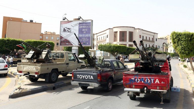 Toyota pick-up trucks mounted with anti-aircraft guns outside the Libyan foreign ministry (April 28 2013)