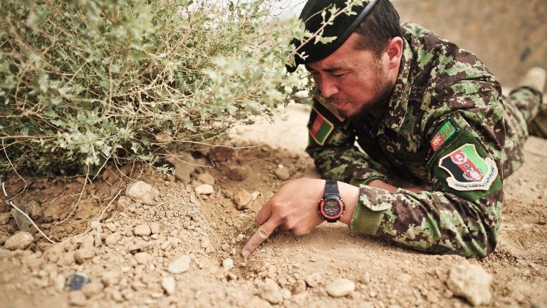 Sgt Abdullah Rezai, of the Afghan National Army, is trained in bomb disposal