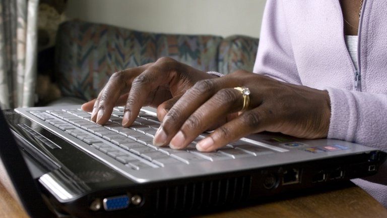Woman typing on laptop