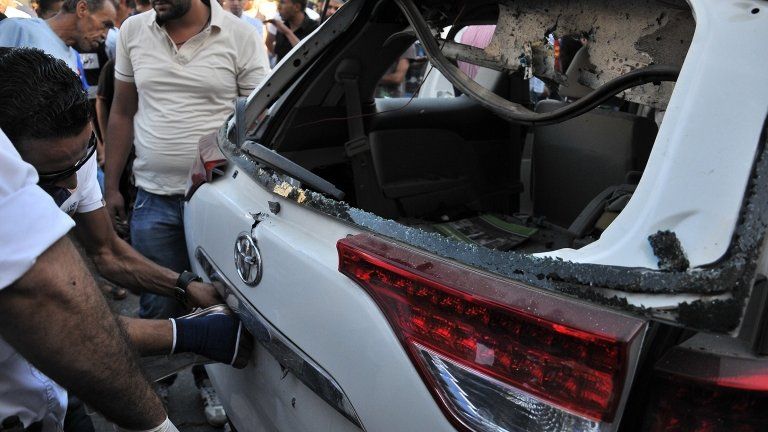 Back of Italian embassy car damaged by a bomb, Tripoli, 11 June 2013