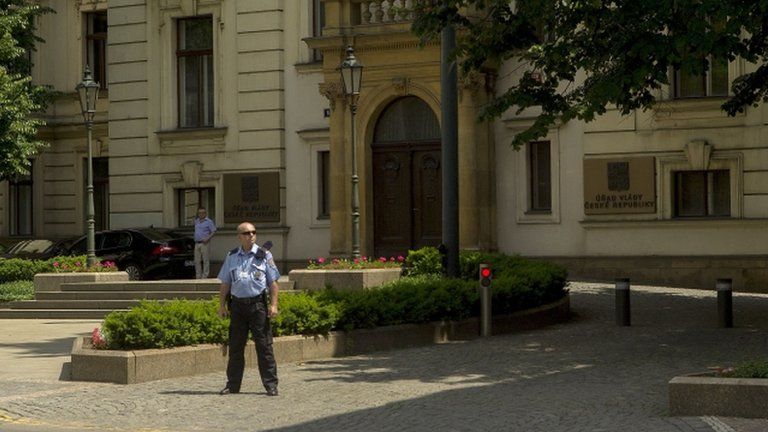 A policeman stands guard in front of the Czech government headquarters
