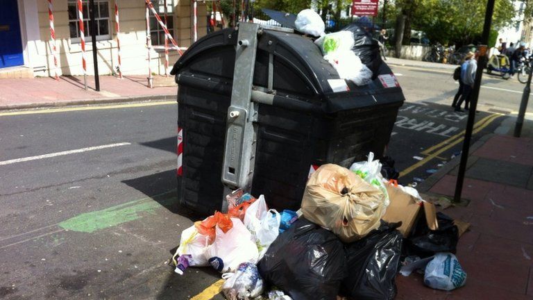 Overflowing rubbish bin in Brighton