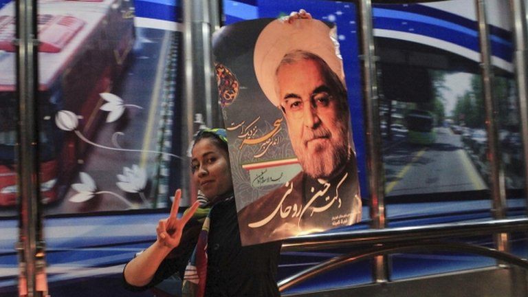 A supporter of moderate cleric Hassan Rohani celebrates his victory in Iran"s presidential election