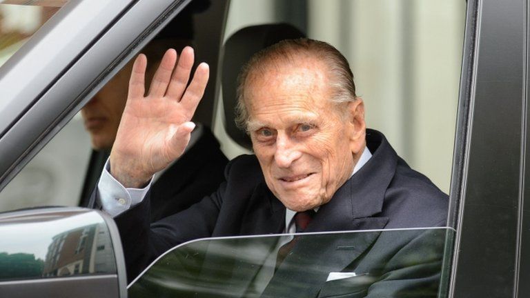 Prince Philip waves as he leaves hospital