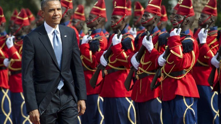 US President Barack Obama reviews a guard of honour on 27June 2013 outside the presidential palace before meetings in Dakar, Senegal