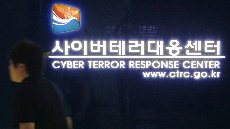 File photo: A South Korean man walks past a gate at the Cyber Terror Response Center of the National Police Agency in Seoul on 25 June 2013