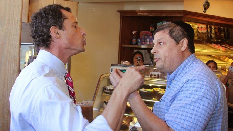 Anthony Weiner, left, who is seeking the Democratic nomination to run for the New York City Mayor’s Office, has a heated argument with Shaul Kessler at Weiss Bakery in the Boro Park neighborhood in the Brooklyn borough of New York 4 September 2013
