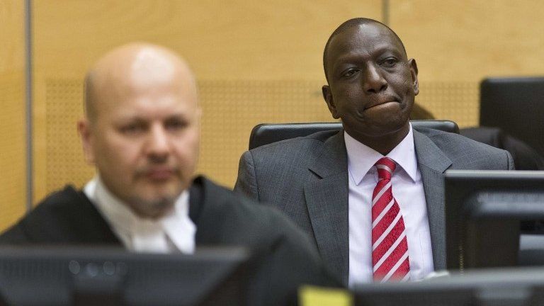 Kenya"s Deputy President William Ruto (R) reacts as he sits in the courtroom before his trial at the International Criminal Court (ICC) in The Hague September 10, 2013.