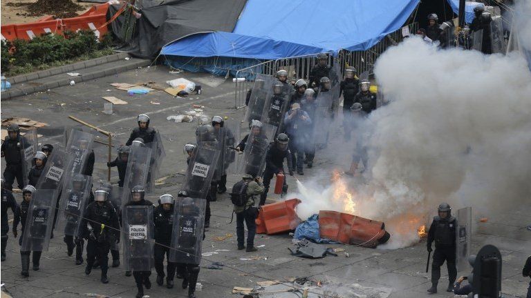 Police enter Zocalo Square in Mexico City
